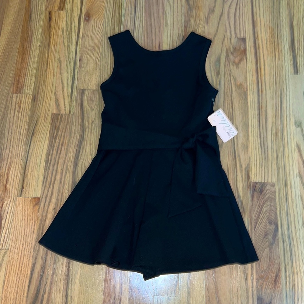 Simple and cute black romper is size 10 youth from sallymiller couture